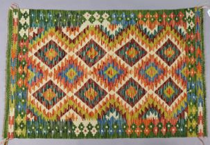 A Chobi Kilim rug of multi-coloured geometric design 132cm x 85cm.