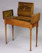 An Edwardian “Britisher” oak writing desk with a fitted interior enclosed by three hinged