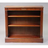A 19th century-style mahogany small standing open bookcase with two adjustable shelves, & on a