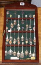 A collection of approximately one hundred & twenty various souvenir teaspoons contained in on glazed