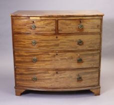 An early 19th century mahogany bow-front chest fitted two short & three long graduated drawers