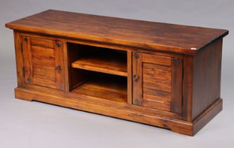 A hardwood rectangular dwarf side cabinet with an open shelf to centre flanked by a cupboard to