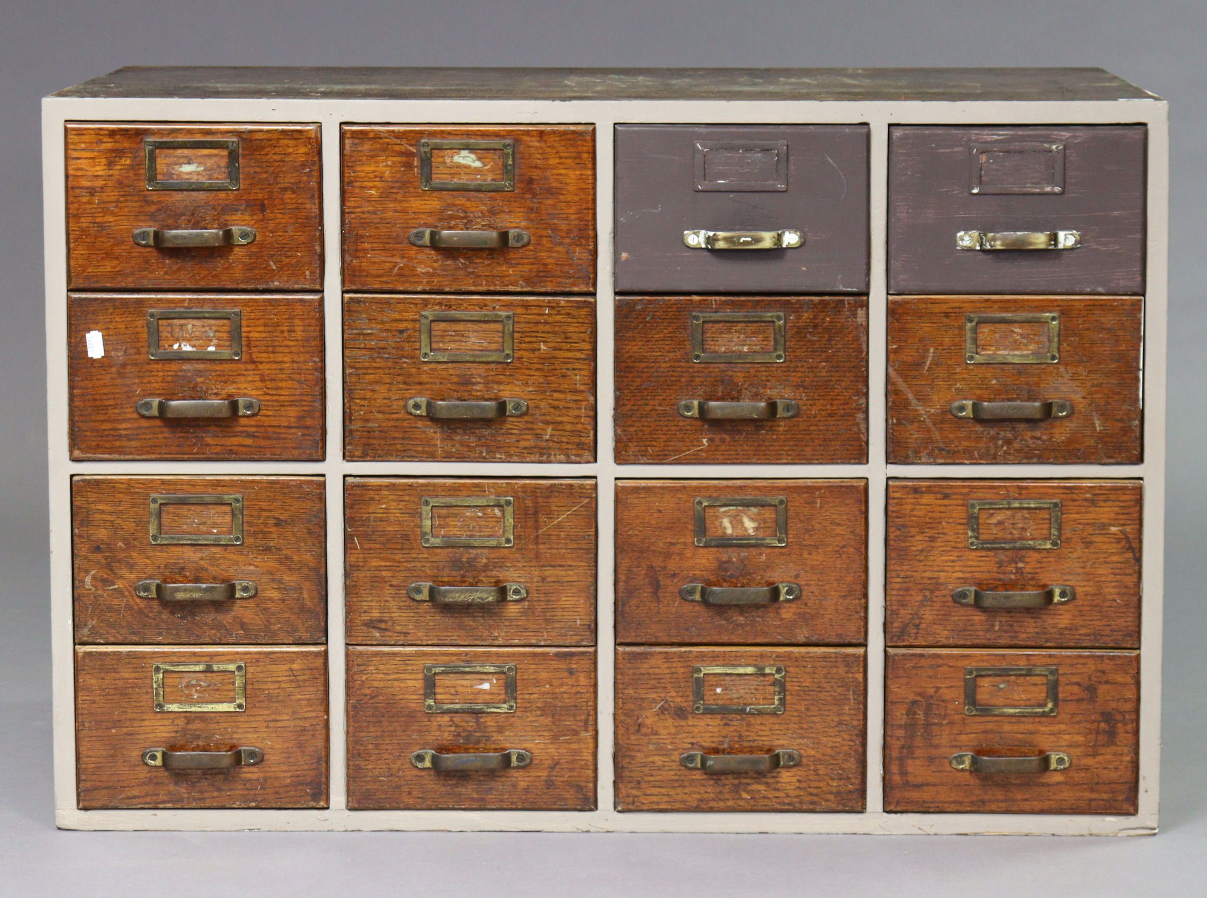 Another mid-20th century oak counter-top office chest fitted four banks of four drawers with brass