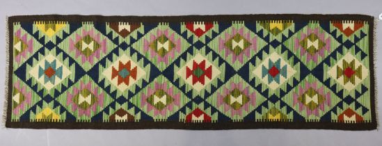 A Maimana Kilim runner of multi-coloured geometric design 205cm x 63cm