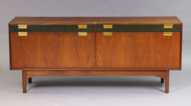 A mid-20th century Greaves & Thomas teak sideboard fitted two frieze drawers above cupboards