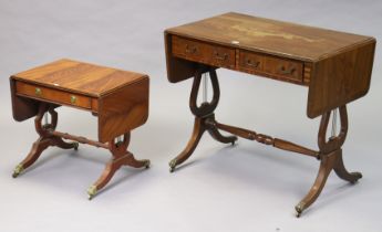 A reproduction mahogany drop-leaf sofa table fitted two frieze drawers, & on lyre-shaped end
