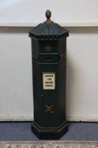 A 20th century novalty cabinet in the form of a post box, with single door enclosing five small she