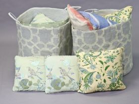 Four weaver green laundry bags; a small rug & various scatter cushions.