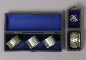 Four silver napkin rings (various hallmarks).