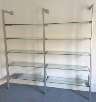 An Ikea “Anga” tall silvered-metal wall mounted wall-unit with three silvered-metal supports &