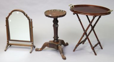 A hardwood wine table with a moulded pie-crust edge to the circular top, & on a turned & fluted