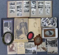 A collection of assorted family photographs, photograph frames, etc., circa. early/mid-20th century.