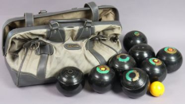 A matched set of eight Lignum Vitae lawn bowls, with case.