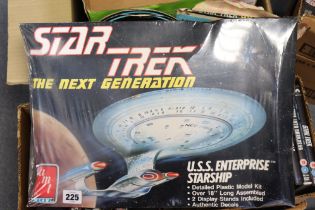 Three “Star Trek” model kits, four “Star Trek” jigsaw puzzles, all boxed; & various “Star Trek” DVDs