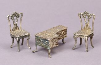 A George V silver embossed miniature dolls-house piano, 5.75cm wide, Birmingham 1920; & a similar