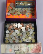 A quantity of foreign coins, banknotes, a few British coins, etc.