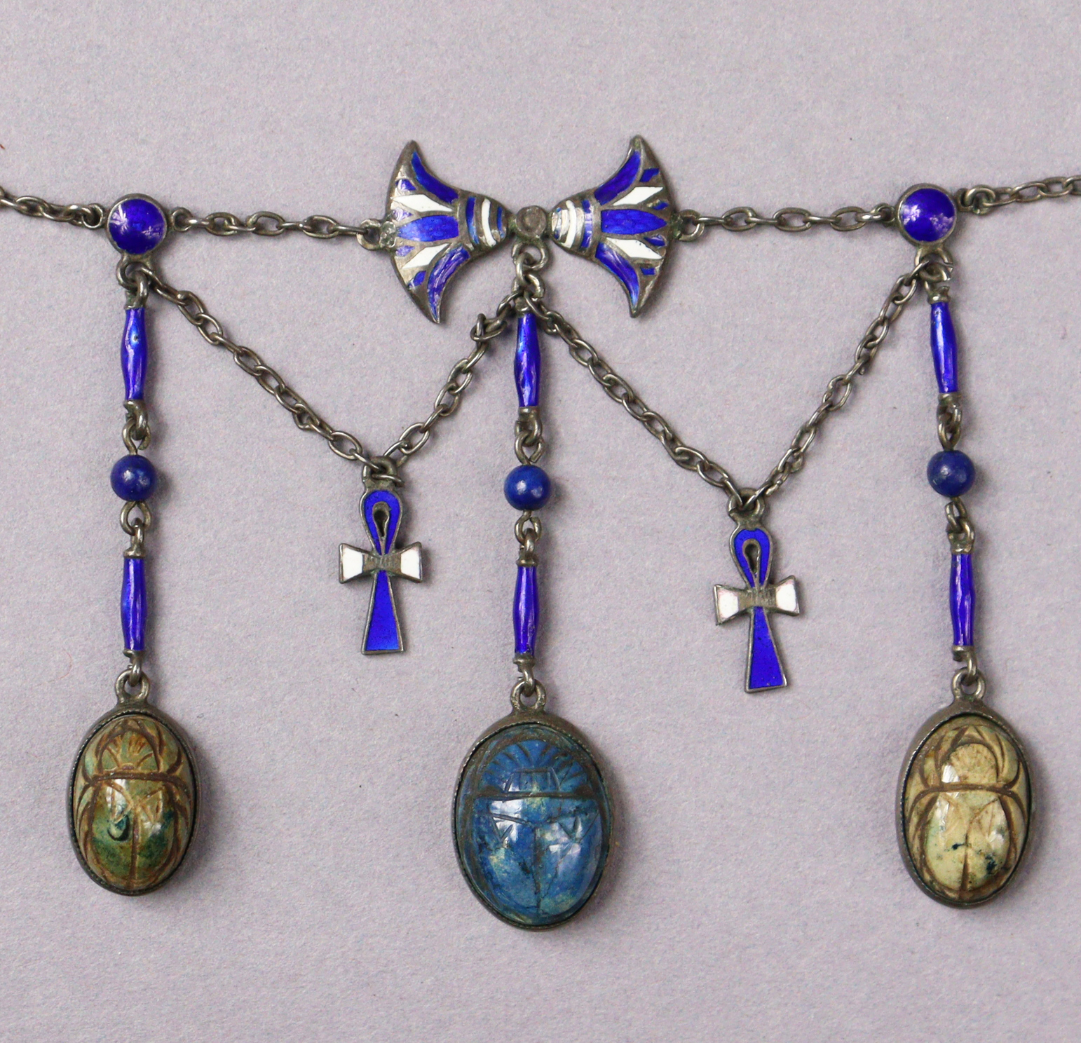 An Egyptian silver & enamel necklace with three scarab pendants, 37cm long.