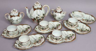 A Japanese porcelain fourteen-piece part tea service of white ground & with multi-coloured figure-