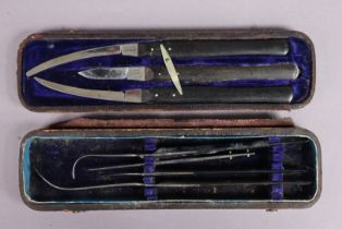 A late 19th century four-piece part surgical instrument set in a Morocco leather case, bears