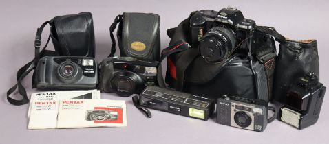 A Nikon “F-401” camera; together with four other cameras.