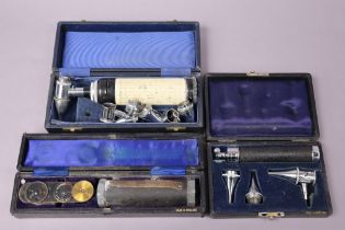 A vintage Anumbra ophthalmoscope; & two vintage Gowlland ophthalmoscopes, all cased.