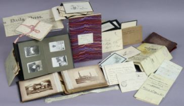 A late 19th/early 20th century small leather-bound photograph album containing sixty-two photographs