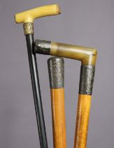Three various antique gent’s walking canes, two with silver mounts.