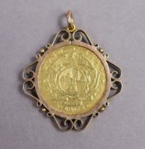 A South African gold 1 Pond coin, 1898; forming a pendant with 9ct. scroll mount.