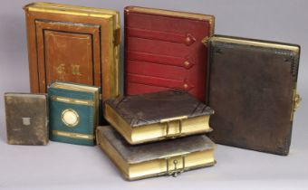 Seven various leather-bound family photograph albums (without contents).