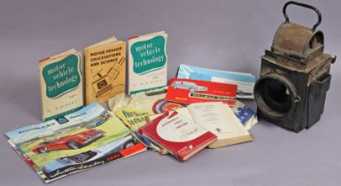 A vintage BR (M) M railway lantern, w.a.f., 36cm high; & various books & booklets on motor cars.