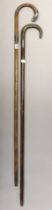 Two vintage gent’s walking canes, each with silver mounts, both 93cm high.