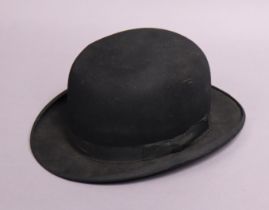 A vintage Dunn & Co. of London black felt bowler hat.