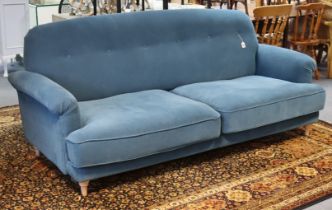 An Ikea “Esseboda” three-seater settee with a buttoned-back, scroll-arms & with loose cushions to