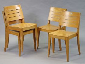 A set of four stacking wooden chairs each with a hard seat & back, & on square tapered legs.