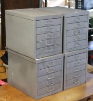 A set of four sandblasted grey metal five-drawer table-top office chests, 28cm wide x 32cm high x