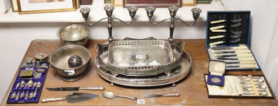 A pair of silver-plated twin-branch table candelabra; three silver plated tea-trays; & various other