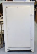 A white painted pine tall cupboard fitted two shelves enclosed by a panel door, 83.25cm wide x 137cm