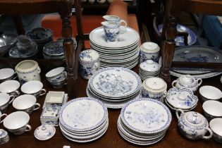 A Japanese porcelain blue & white floral decorated extensive one hundred & thirteen piece dinner &