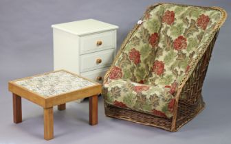 A wicker low easy chair with an all-in-one padded seat & back upholstered multi-coloured foliate