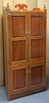 A mahogany tall tray-top cupboard enclosed by two pairs of fielded panel doors, 77cm wide x 177cm