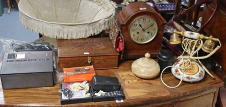 An Edwardian mantel clock in a mahogany case, 30cm high; a retro-style telephone; a dressing table