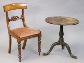 A 19th century oak tripod table with a circular top; & on a vase-turned centre column & three