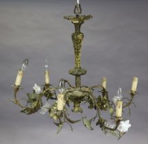 A 20th century continental gilt-metal electrolier, of rococo design, the foliate arms with white &