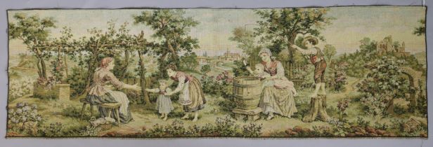 A French tapestry depicting numerous figures in a garden landscape, 46cm x 146cm.