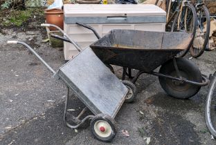 Two Bosch hedge cutters, both boxed; a Ryobi garden leaf-blower; two wheelbarrows; and an outdoor