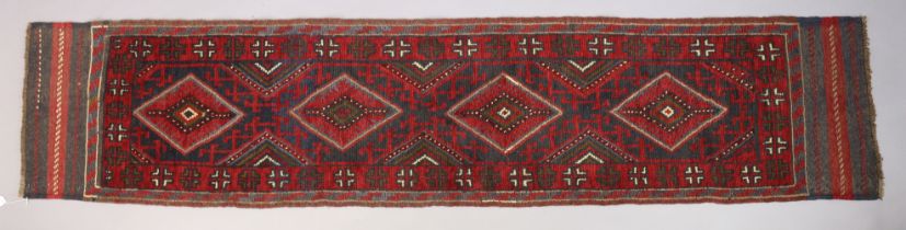 A Mashwani corridor runner of crimson & ivory ground, & with all-over repeating geometrical design