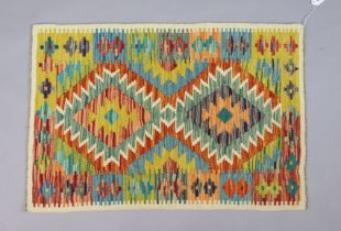 A Chobi Kilim small rug of multi-coloured geometric design, 90cm x 60cm.