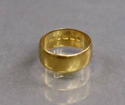 A 22ct gold plain band, size M (5.8g).