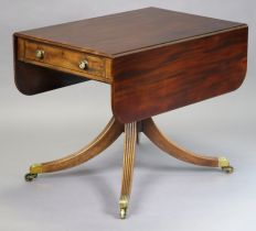 A Regency mahogany drop-leaf table fitted with a single drawer to one end, a mock drawer to the