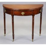 A 19th century mahogany demi-lune tea table with fold-over top, fitted frieze drawer with brass drop